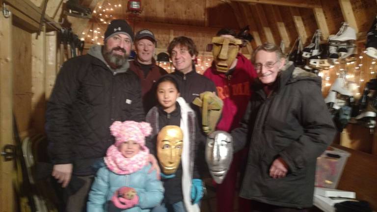 Festival breathes life into the 'dead of winter' Inside the warming hut, in the back row: Glenn Heller, Scott Sheldon, Mike Zimmerman, and Bradlee Sheldon (wearing a mask.) Front : Daisy Oliva Heller, Abbey Zimmerman, and Mike Carson. (Photo by Anya Tikka)