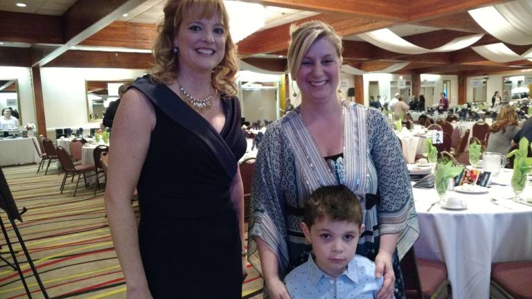 'A wonderful affair' This year’s featured child, Matthew Wagner, with mom, Nicole, and MC Kelly Gaughan (Photo by Anya Tikka)