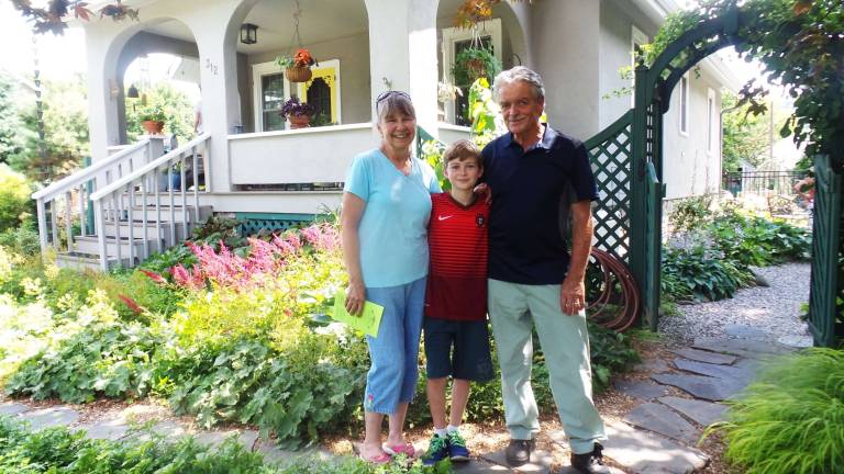 Milford's gardens, revealed Connie and Rick Nichols with their grandson, Luke Adams, in their stunning garden