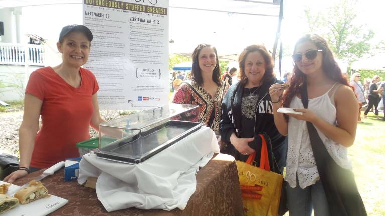 Milford gets fresh Teresa Montanino, Phyllis Witt and Giamna Bullaro sample Maria Lange’s stuffed pastries and breads (Photo by Frances Ruth Harris)