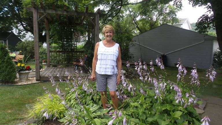Milford's gardens, revealed Pat Hendershot, a member of the Milford Garden Club, at Remembrance Place