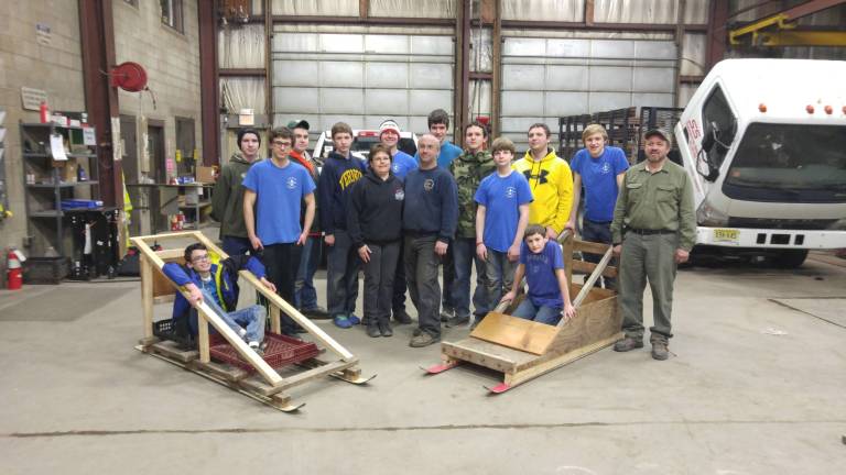 Shohola Scouts prepare for Klondike Derby Pictured in the sleds are J.D. Flick (left) and Vincent Saski, in the center, Karin (left) and Ray Willis, and in the back row (from left): Jake Barth, John Anthony Cirello, Joey Loughney, Gavin Braznaskas, Jake Mills, Jonathan Langberg, Joey Seltzer, Aidan Stone, Thomas Seltzer, Sean Rinkel, and Herb Rinkel, Scoutmaster (Photo provided)