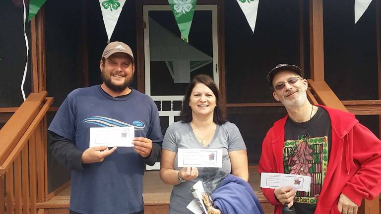 Hot stuff From left, Chili Contest winners Chuck Williams, Susan Mazza and Robert Skillin strut their stuff.