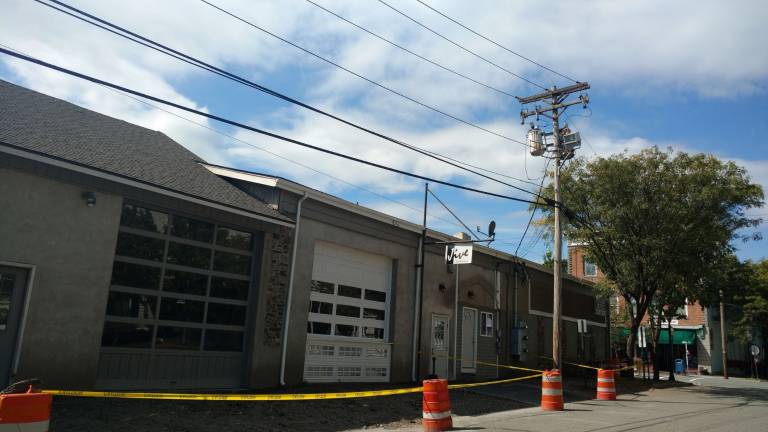 Renovated Jive Bar on the level with permits, officials say Extensive work on the sidewalk next to Jive Bar, where the old garage entrance can also be seen (Photo by Anya Tikka)