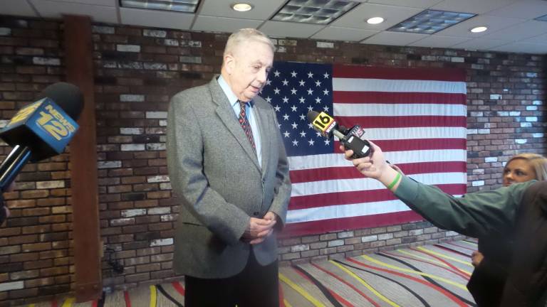 More guns means a safer society, dinner guests say Keynote speaker Larry Pratt speaks to the media (Photo by Frances Ruth Harris)