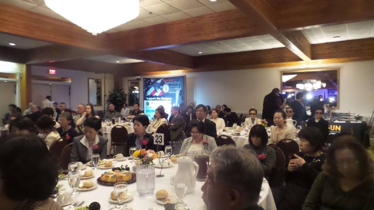 More guns means a safer society, dinner guests say (Photo by Frances Ruth Harris)