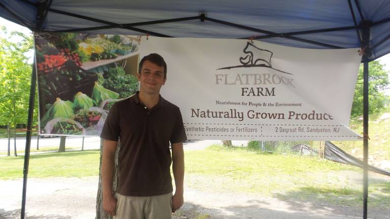 Milford gets fresh Flatbrook Farm’s Steven Hendershot offers naturally grown products. Flatbrook Farm is a family farm in Northern New Jersey that sells beef, pork, chicken and eggs. The animals are raised ethically through humane handling practices, fed non-GMO feed, a grass based diet, and are antibiotic and growth hormone free. (Photo by Frances Ruth Harris)