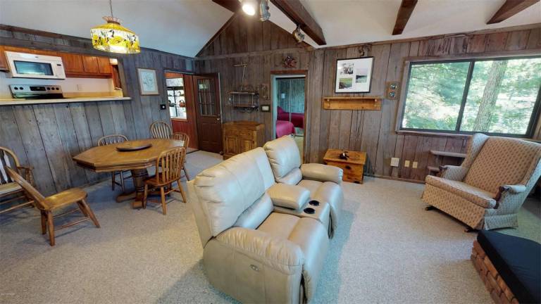 Four-bedroom lakefront contemporary is just steps from beach Eating and living area