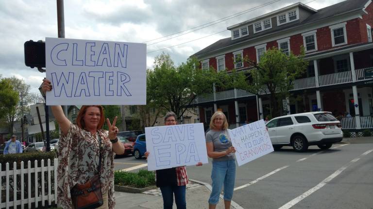 'This should be of concern for everyone' Photos by Anya Tikka Marchers carried signs and stood on corners throughout Milford last Saturday in a sister march to bring awareness to climate change and the validity of science.