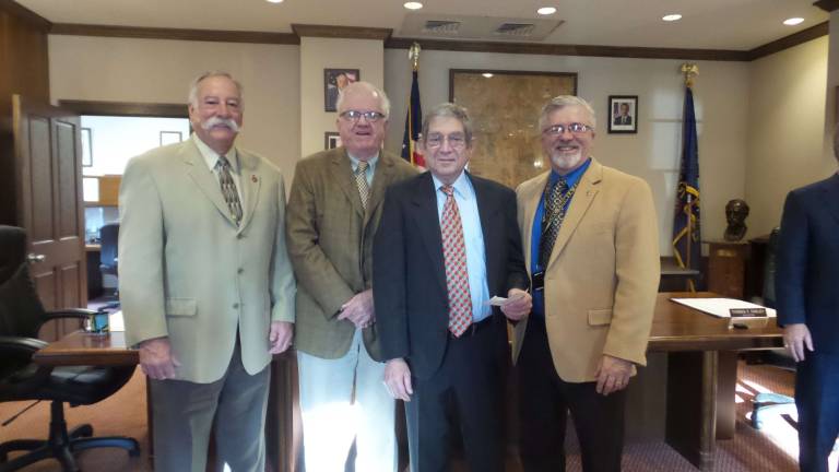 No tax increase in county budget next year Commissioners Matt Osterberg, Rich Caridi and Karl Wagner flanked by Chief Clerk Gary Orben and Solicitor Thomas Farley (Photo by Frances Ruth Harris)
