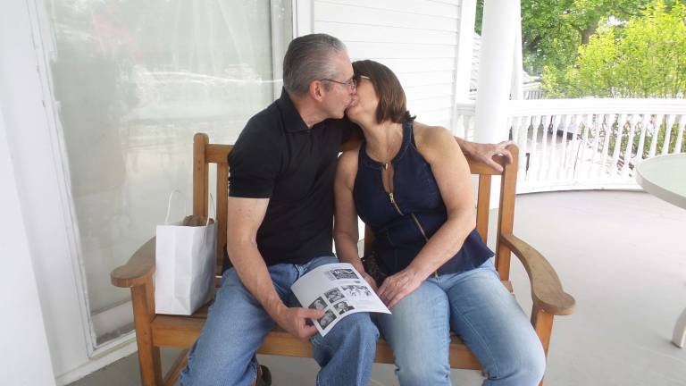 Milford gets fresh Thirty-eight years ago, Paul and Jane Vitta became man and wife. Just after they married, they sat on a bench and a reporter asked them to kiss. They did. Jane carries the kissing picture from their wedding day on her phone. She discovered it on the internet through a search! She said they were thrilled to kiss again for The Courier on the veranda of The Columns Museum. (Photo by Frances Ruth Harris)