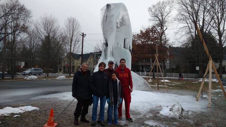 Festival breathes life into the 'dead of winter' An ice sculpture takes shape around a light structure. From left: Mike Carson, Mike Zimmerman, Bradlee, and dad Scott Sheldon. Abbey Zimmerman is in front. (Photo by Anya Tikka)
