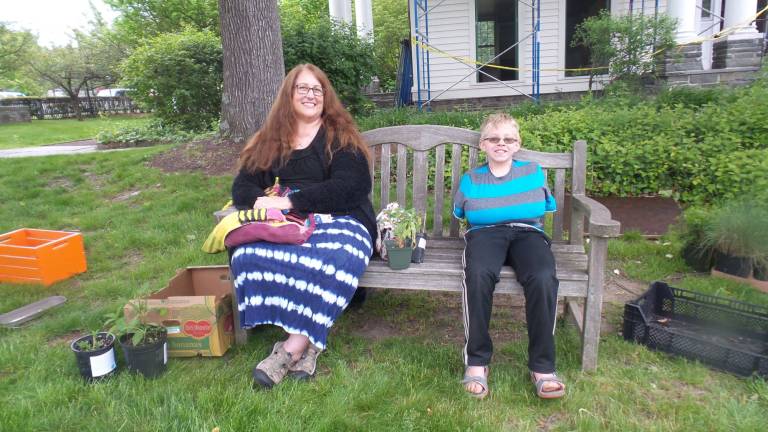 Gardens grow with help from annual plant sale Grandmother Gernilee Schombs with grandson Samuel Troxel seeking black-eyed Susans (Photo by Frances Ruth Harris)