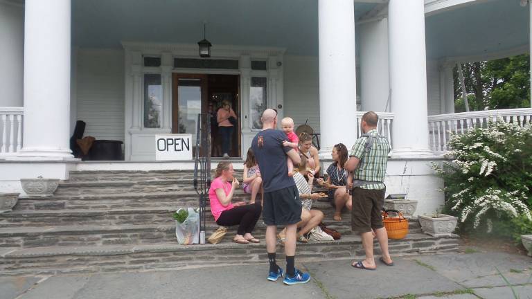 Milford gets fresh People feasted in a variety of spots around The Columns Museum. The said they delights and the fresh and delicious food at the Milford Farmers Market after a long snowy winter. (Photo by Frances Ruth Harris)