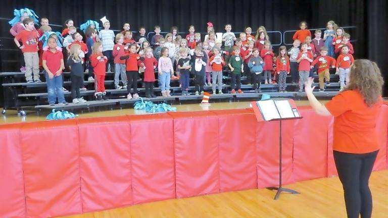 Miss Rainey and the kindergartners practicing for their concert (Photo by Peggy Snure)