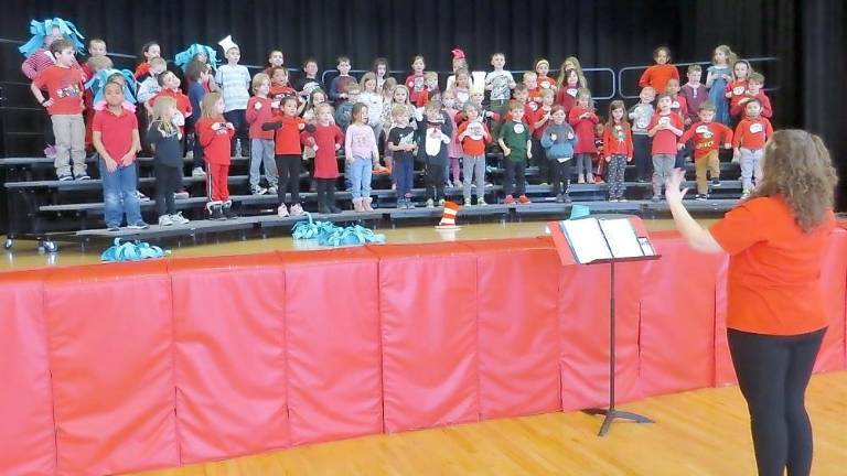 Miss Rainey and the kindergartners practicing for their concert (Photo by Peggy Snure)