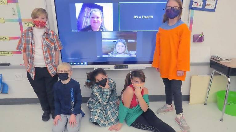 From left: Raymond Leimkuhler, Connor Stewart, Daisy Olivo Heller, Emma June May, and Rogue Cronin-Snook. Smartboard (from left): Trent Kaylor, Taryn Kaylor (Photo by Peg Snure)