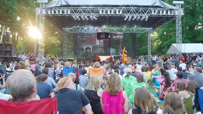 Music lovers listen to performers on a temporary stage set up at Ann Street Park during the 2009 Milford Music Festival (File photo by Nick Troiano)