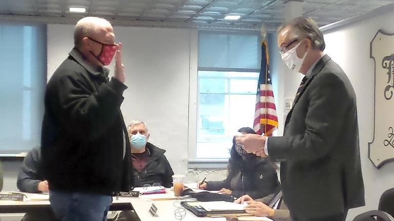 Newest borough council member Dale Thatcher was sworn in by Mayor Sean Strub. (Photo by Frances Ruth Harris)