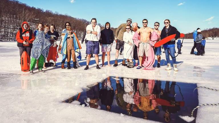 Lake Stockholm Polar Bear Plunge raises money for swim team and scholarship fund Lake Stockholm Polar Bear Plunge raises money for swim team and scholarship fund