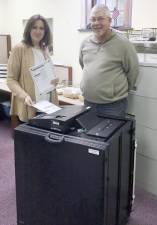 Nadeen Manzoni is pictured last fall with one of Pike's new voting machines and Jeff Phillips, customer relations manager for Dominion Voting Systems.