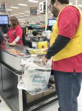 An employee of ShopRite in Warwick, N.Y., said ShopRite would also offer paper bags for a five cent fee beginning March 1. Linda Smith Hancharick