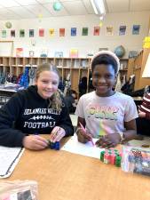 DVES students work with unit cubes to learn about volume.