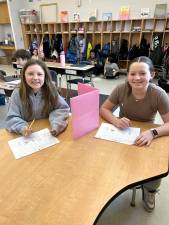 L-R: Kyleigh Sandsmark, Vayda Kresse play battleship math at DVES.