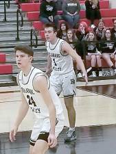 Jackson Shafer (#24) with Aiden Oliver (#1) rebounding