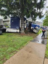 A damaged 2016 Freightliner comes to a rest after wreaking havoc and killing one in Milford July 29.