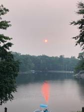 The lake at Wild Acres in Dingmans Ferry, PA shines with an orange reflection from the sun July 16. Photo provided.