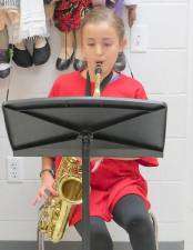 Saxophonist Rylee Nitecki plays the National Anthem