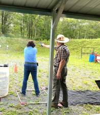 Steel Challenge Match shooter Charlene Foltzer and timer Bob Taylor.