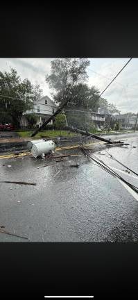 An out of control tractor trailer leaves a trail of destruction July 28 on West Hartford Street in Milford.