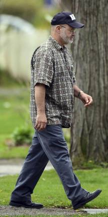 Bryon K. Dickson, father of slain Pennsylvania State Police Trooper Cpl. Bryon Dickson II, walks to an attorney's office next to the Pike County Courthouse on Wednesday, April 26, 2017, in Milford, Pa. Eric Frein, the would-be revolutionary who shot two Pennsylvania troopers, one fatally, in a late-night attack at their barracks, was sentenced to death late Wednesday. Cpl. Bryon Dickson II, a Marine veteran and married father of two, was killed, and Trooper Alex Douglass was critically wounded. (Butch Comegys/The Times &amp; Tribune via AP)