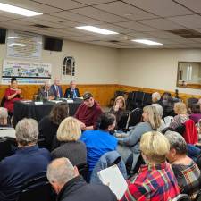 The candidates for Pike County commissioner get ready for the debtate to begin.