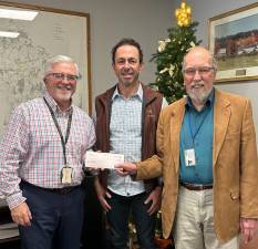 Commissioner Matthew Osterberg, Kinder Morgan Public Affairs Vice President Alan Fore, and former Commissioner Tony Waldron.