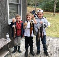 Dylan DeFebo, Landon DeFebo, and Liam Payne with their catches of the day.