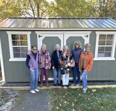 From left, Valerie Brairton, Maria Longono, Vikki Callahan, Judyth Casey, Mary Sorrell and Pat Hendershot near the new Remembrance Place shed.