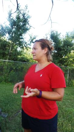 4H Master Gardener Angela Williams makes a point about growing food (Photo by Frances Ruth Harris)