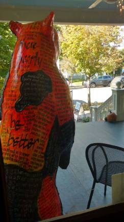 An Artful Bear sculpture to be auctioned off enjoys the view from the Patisserie Fauchere terrace (Photo by Anya Tikka)