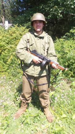 Terrance Ring with a Thompson Machine. He also carries a shovel as part of his equipment. (Photo by Frances Ruth Harris)