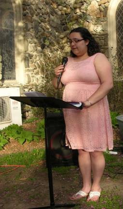 Photos by Anya Tikka Outreach coordinator Kayla Bolger emceeds the "Take Back the Night" event.