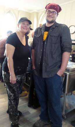 Volunteers Lori Ann Hines and Daniel Davis in the kitchen