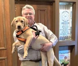 <b>Pike County Treasurer John Gilpin and his licensed dog, Maine.</b>
