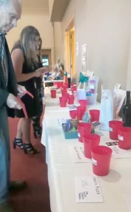 Guests put their tickets in blue and red cups to win prizes.