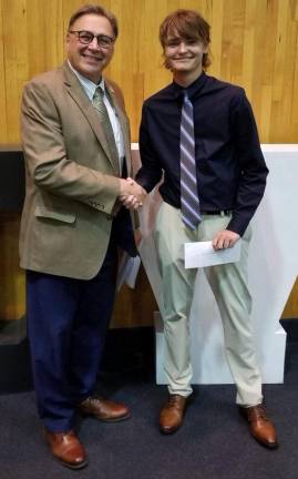 Milford Matamoras Rotary Club member Jack Fisher presented Clint Murray with this year’s Stephen Faller Memorial Scholarship. Provided photo.