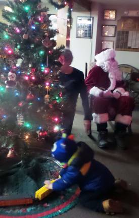 Santa Claus oversees the action in the Foundation Room (Photo by Frances Ruth Harris)