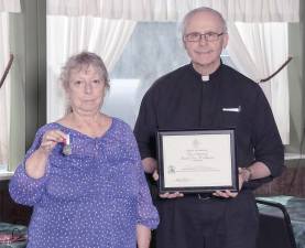 Midge Curreri with The Rev. Joseph Manarchuck (Photo by Thomas Duncan)