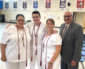 Mary Jane Lawal, Jessica Peterson, Dorothy Tighe and WMH CEO James Pettinato. The nurses are the first class of hospital-sponsored LPNs.